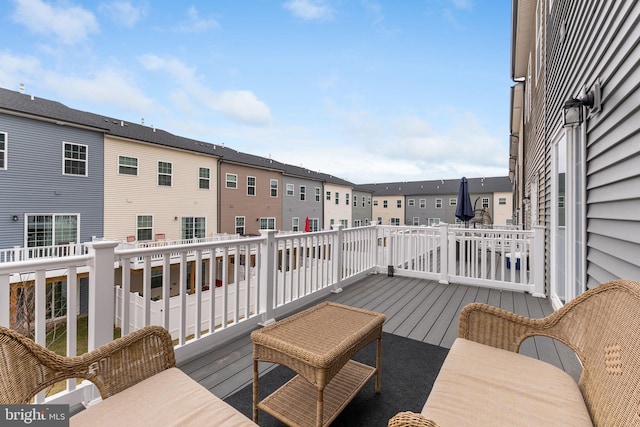 wooden terrace with a residential view