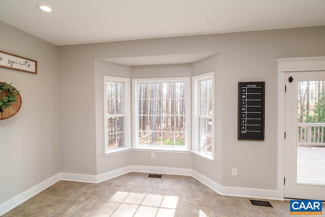 unfurnished dining area featuring visible vents, recessed lighting, and baseboards