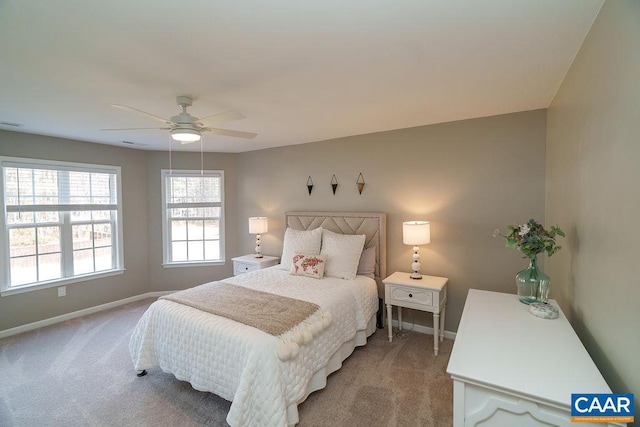 carpeted bedroom featuring visible vents, baseboards, and a ceiling fan