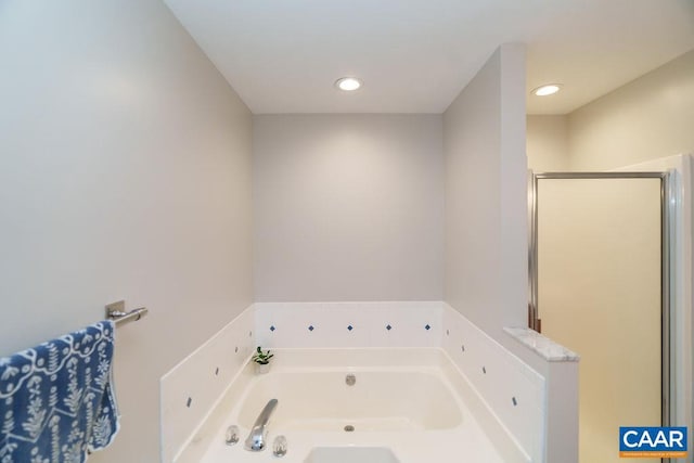 full bath with a garden tub, recessed lighting, and a stall shower