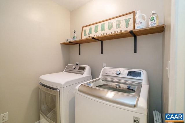 clothes washing area with laundry area and washer and dryer