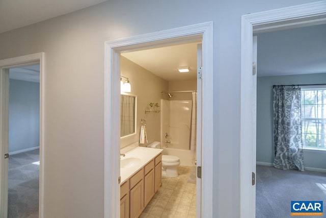 full bathroom with toilet, vanity, baseboards, and washtub / shower combination