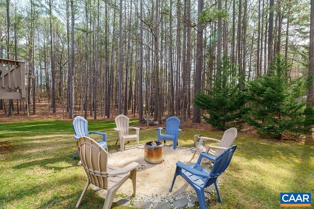 view of yard with a patio and an outdoor fire pit