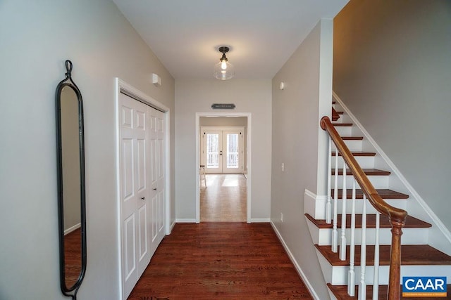 hall with french doors, baseboards, dark wood finished floors, and stairs