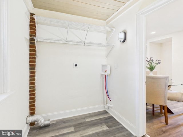 laundry area with wood finished floors, baseboards, hookup for an electric dryer, hookup for a washing machine, and laundry area