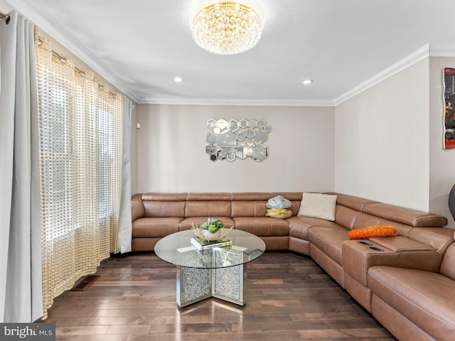 living room with recessed lighting, wood finished floors, an inviting chandelier, and ornamental molding