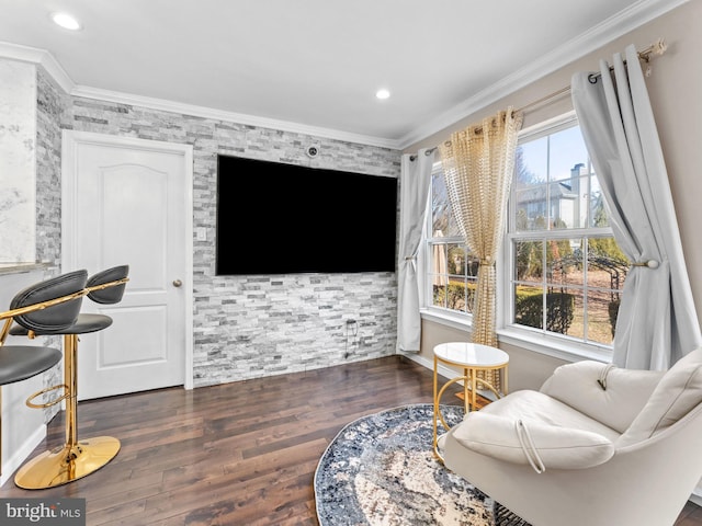 sitting room with recessed lighting, wood finished floors, and crown molding