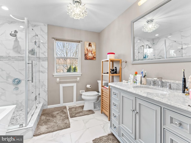 bathroom with a notable chandelier, marble finish floor, toilet, a shower stall, and vanity