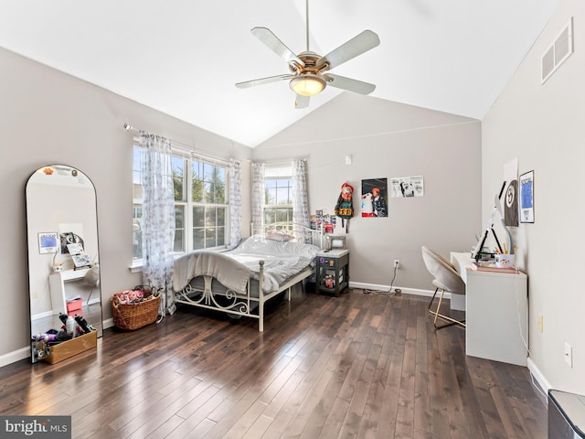 bedroom featuring visible vents, hardwood / wood-style floors, baseboards, lofted ceiling, and ceiling fan