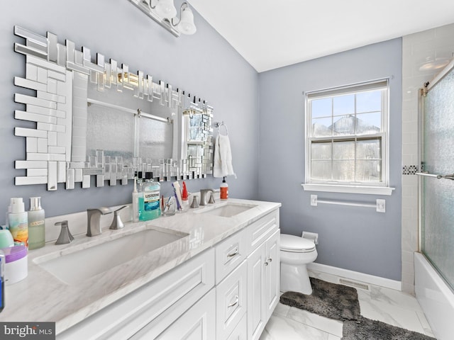 bathroom featuring toilet, visible vents, marble finish floor, and a sink