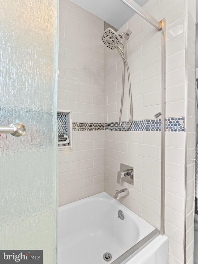 bathroom with shower / tub combination