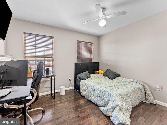 bedroom featuring baseboards, ceiling fan, and hardwood / wood-style flooring