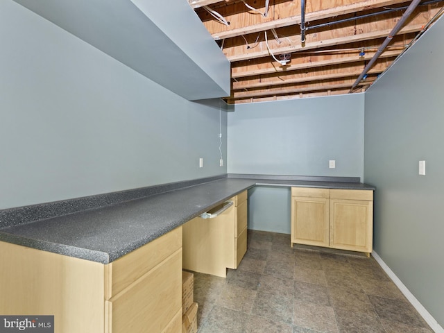 bar with baseboards and built in study area