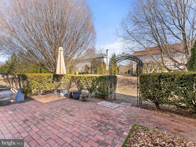 view of patio featuring fence