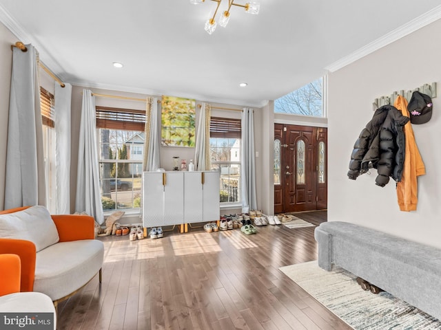 entryway with recessed lighting, wood finished floors, and crown molding