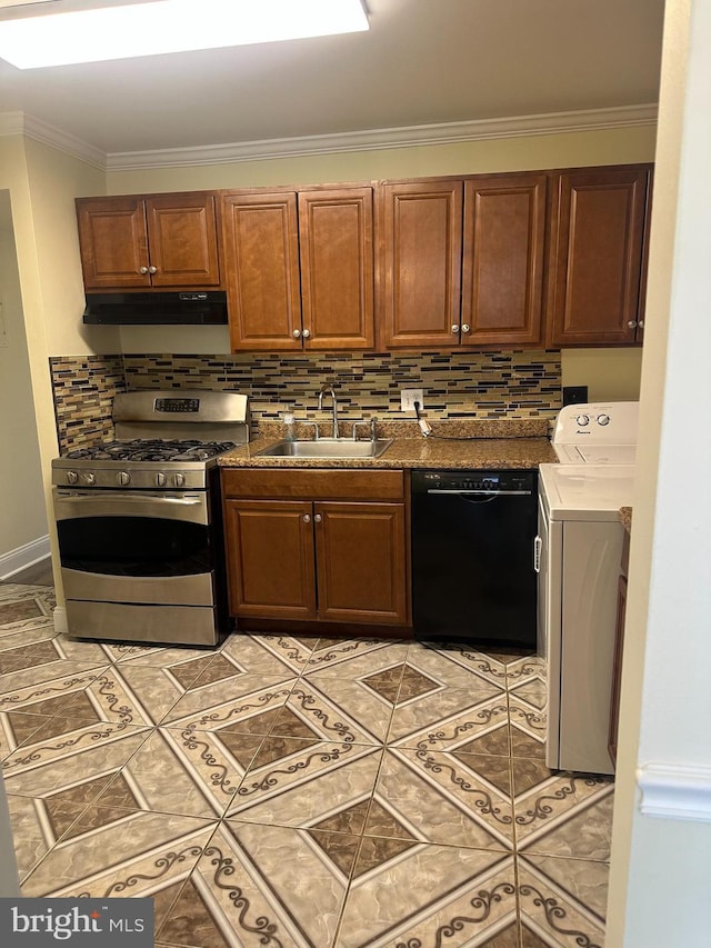 kitchen featuring under cabinet range hood, stainless steel range with gas stovetop, dishwasher, washer / dryer, and a sink