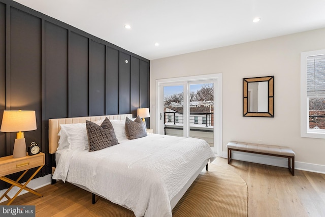 bedroom featuring recessed lighting, baseboards, light wood-style flooring, and access to exterior