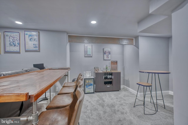 carpeted office with recessed lighting and baseboards