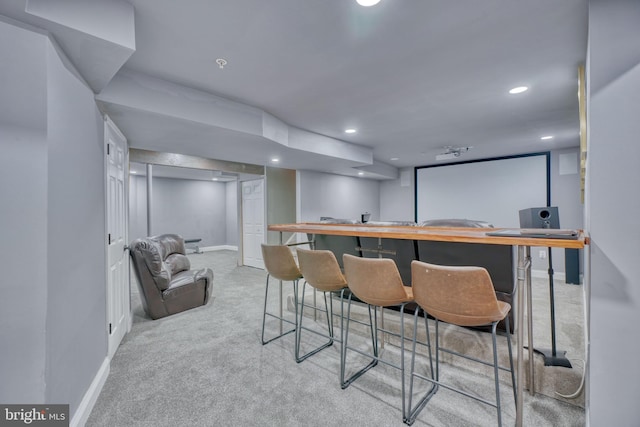 bar featuring recessed lighting, bar area, carpet, and baseboards