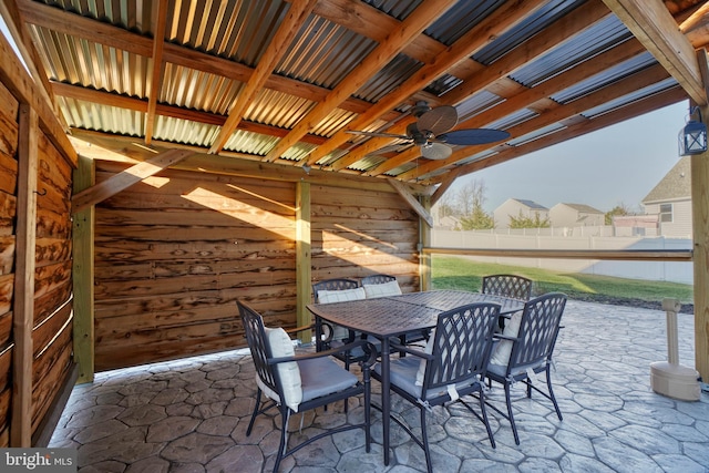 view of patio / terrace featuring outdoor dining space, a ceiling fan, and fence