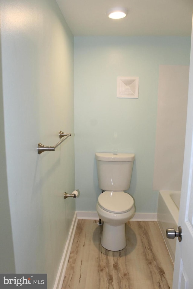208 S Brewster Rd, Vineland, NJ 08361 - bathroom with toilet, wood finished floors, and baseboards