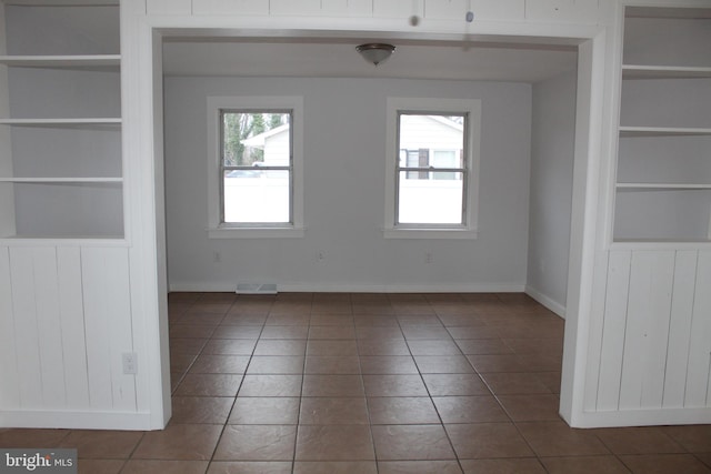 208 S Brewster Rd, Vineland, NJ 08361 - spare room with tile patterned floors, built in shelves, baseboards, and visible vents