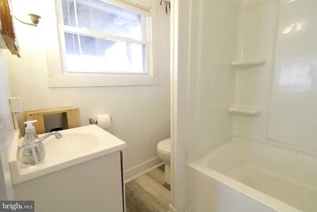 bathroom featuring toilet, wood finished floors, a shower, a bath, and vanity