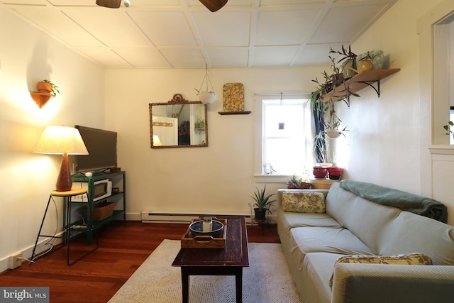 living area with a baseboard radiator, dark wood-type flooring, and coffered ceiling