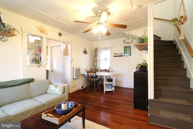 living room featuring visible vents, baseboards, stairway, hardwood / wood-style floors, and a ceiling fan