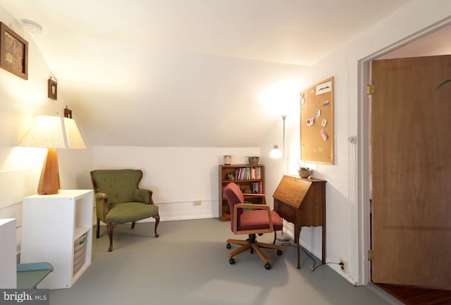 sitting room with vaulted ceiling