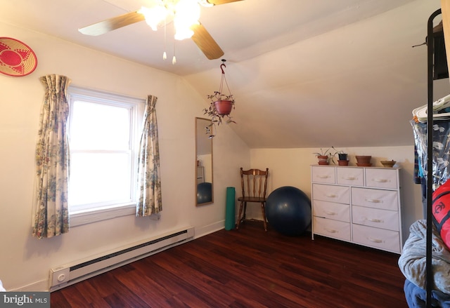 interior space featuring vaulted ceiling, baseboard heating, ceiling fan, and wood finished floors