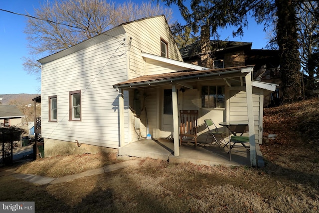 view of side of home featuring a patio area