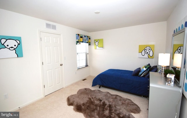 carpeted bedroom with visible vents