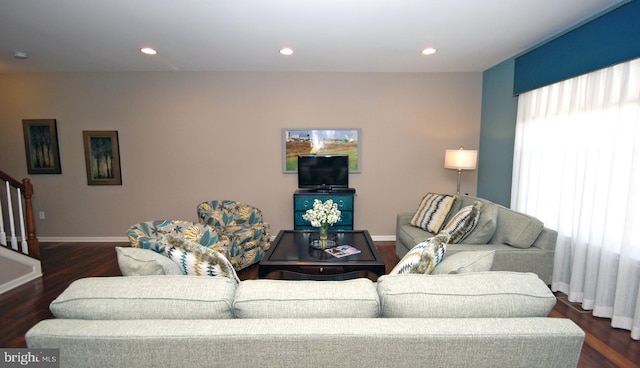 living room with recessed lighting, stairs, and wood finished floors