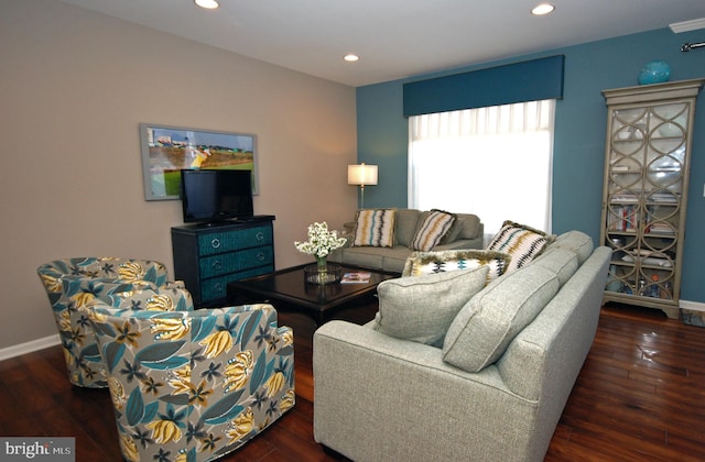 living room with recessed lighting, baseboards, and wood finished floors