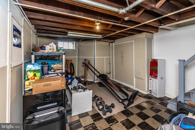 exercise area featuring tile patterned floors