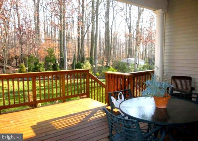 wooden terrace with outdoor dining area