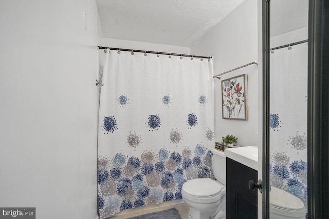 bathroom with vanity, toilet, and a shower with curtain