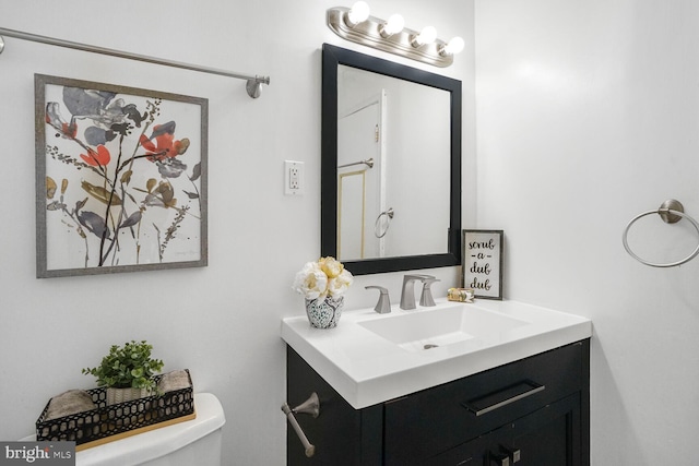 bathroom with toilet and vanity