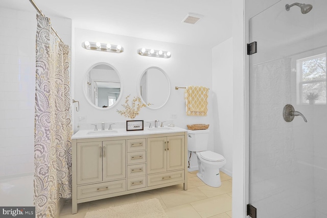 bathroom featuring a sink, visible vents, curtained shower, and toilet