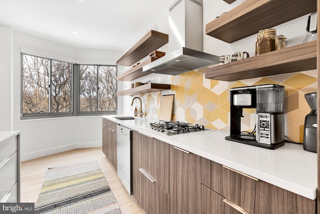 kitchen featuring modern cabinets, open shelves, island exhaust hood, a sink, and stainless steel gas stovetop