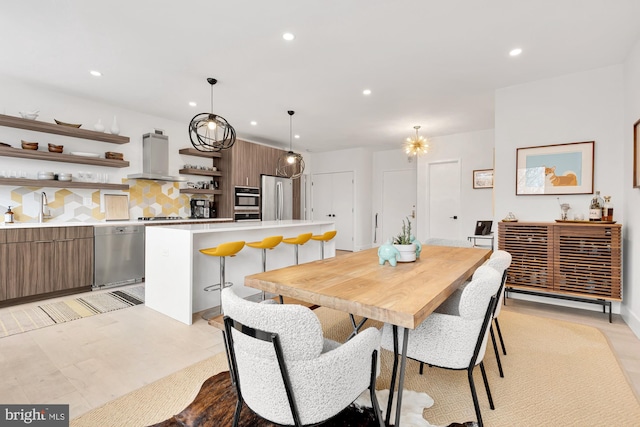 dining space with recessed lighting