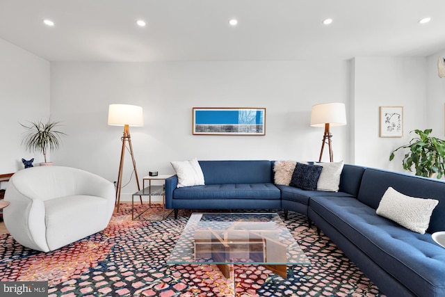 living room with recessed lighting and carpet floors