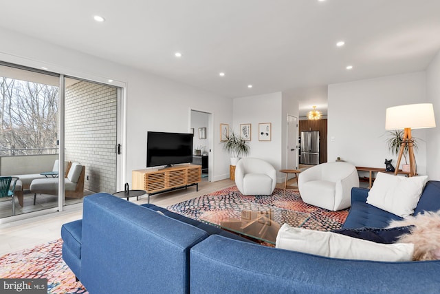 living area featuring recessed lighting and ceiling fan