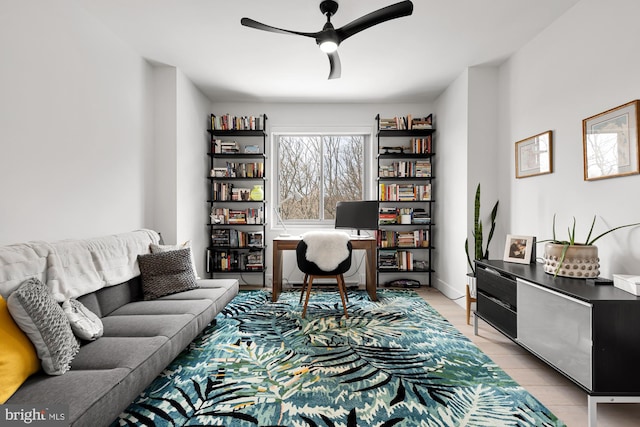 home office featuring light wood-style floors and ceiling fan