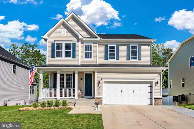 view of front facade featuring an attached garage, central air condition unit, a front yard, covered porch, and driveway