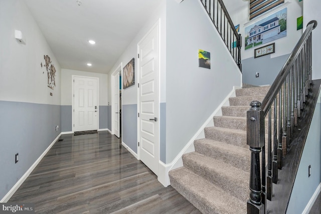 foyer entrance featuring stairway, recessed lighting, wood finished floors, and baseboards