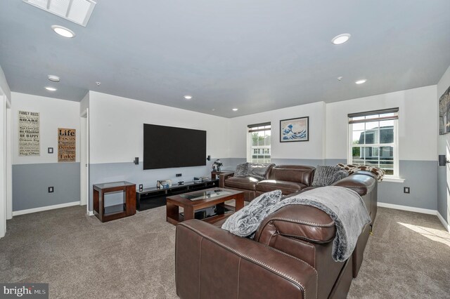 living room with carpet flooring, recessed lighting, baseboards, and visible vents