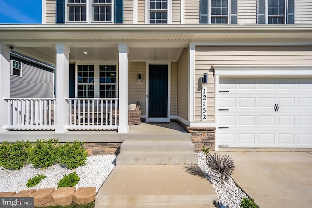 view of exterior entry featuring a porch