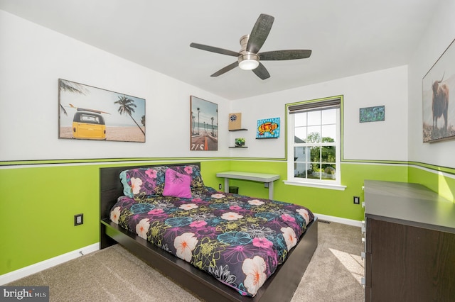 bedroom featuring baseboards, carpet floors, and ceiling fan